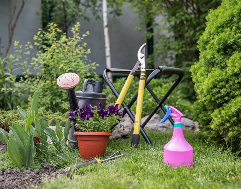 What garden tools do I need? Loopers propped against a gardening stool