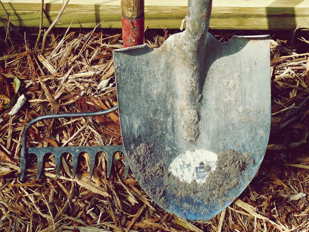 What garden tools do I need? A shovel and a rake propped against the wall